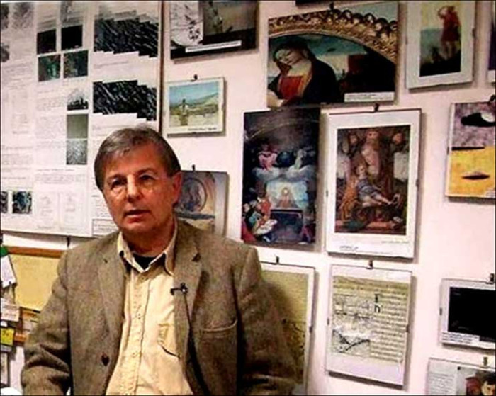 Dr Roberto Volterri in his study at the university, with behind him a good number of images about strange objects