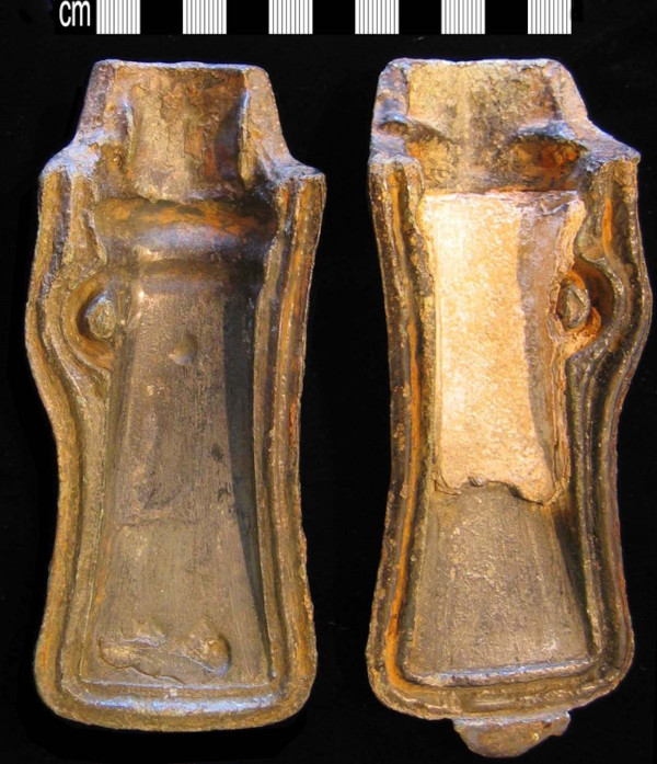 A Late Bronze Age two-part mold used to cast socketed axe-heads.