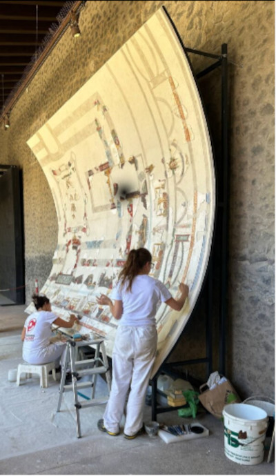 Conservators restoring the ceiling fresco on its innovative curved support.
