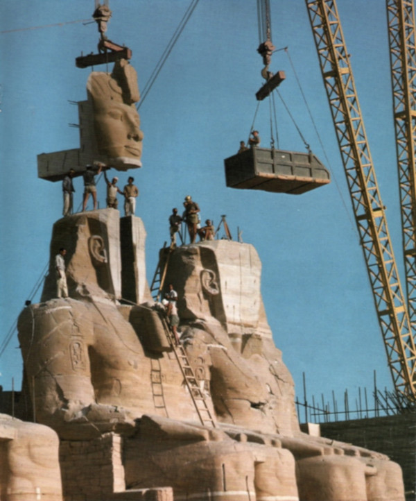 Workers lift sections of the Abu Simbel colossi during the temple’s relocation.