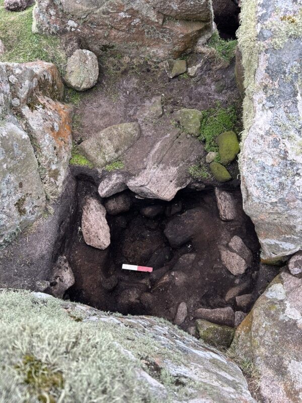 Excavation inside the Leaval chambered cairn ('Witch's Grave')